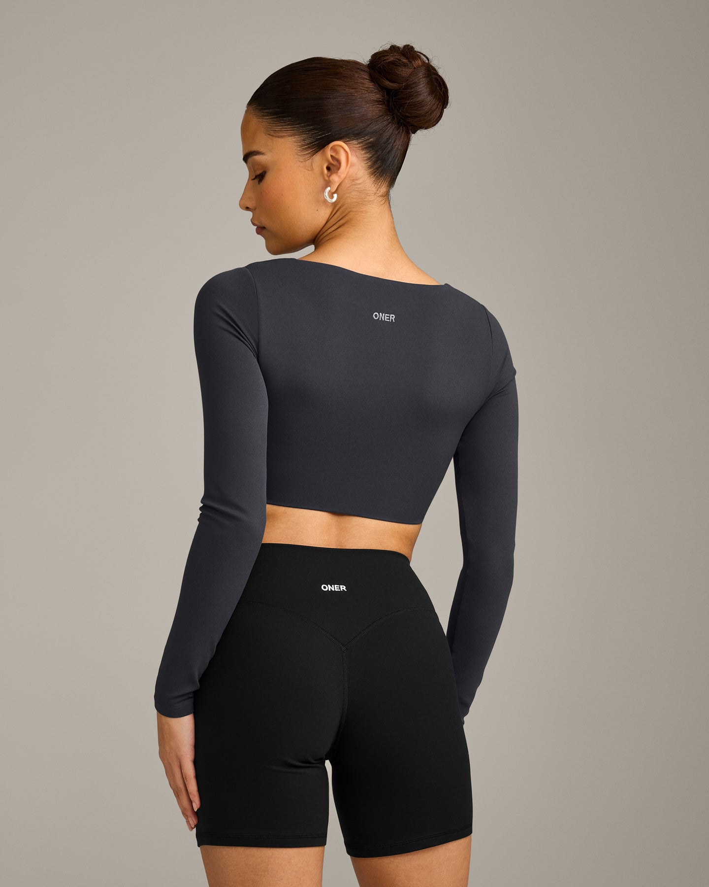 SoftMotion™ Scoop Neck Long Sleeve Crop Top with Built in Bra Shelf with Grey Logo | Coal