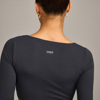 SoftMotion™ Scoop Neck Long Sleeve Crop Top with Built in Bra Shelf with Grey Logo | Coal