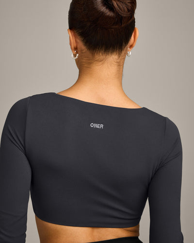 SoftMotion™ Scoop Neck Long Sleeve Crop Top with Built in Bra Shelf with Grey Logo | Coal