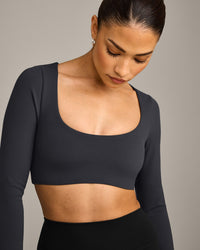 SoftMotion™ Scoop Neck Long Sleeve Crop Top with Built in Bra Shelf with Grey Logo | Coal