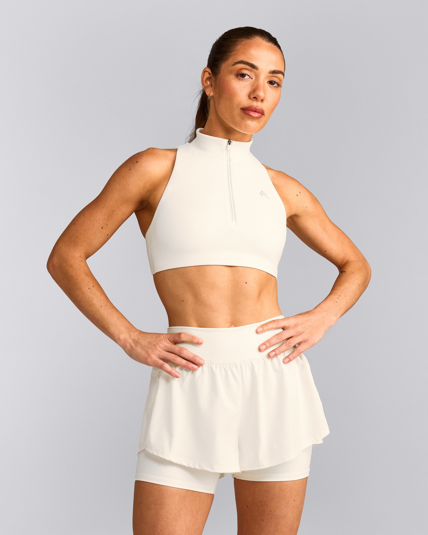 EasyLift™ Zip High Neck Sports Bra with Grey Logo | Marshmallow White