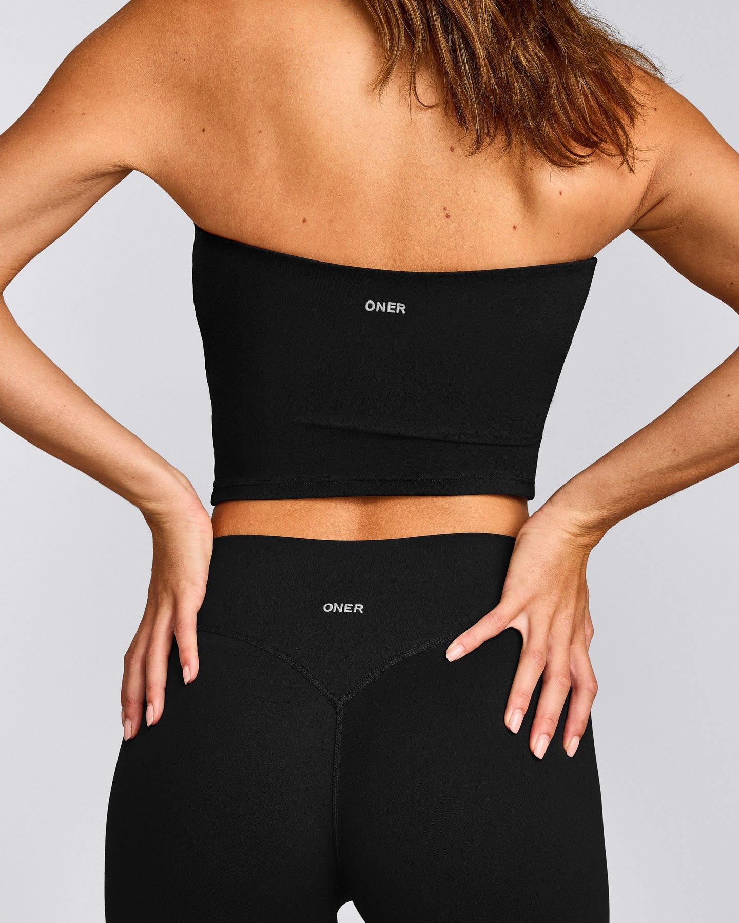 SoftMotion™ Bandeau Mid Vest with Built in Bra Shelf with Grey Logo | Black
