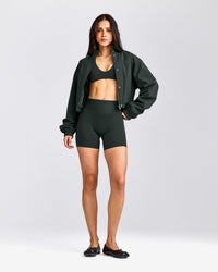 SoftMotion™ Minimal Halter Neck Bralette with Grey Logo | Emerald Noir