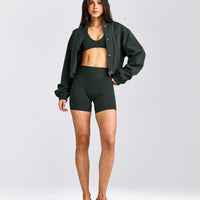 SoftMotion™ Minimal Halter Neck Bralette with Grey Logo | Emerald Noir