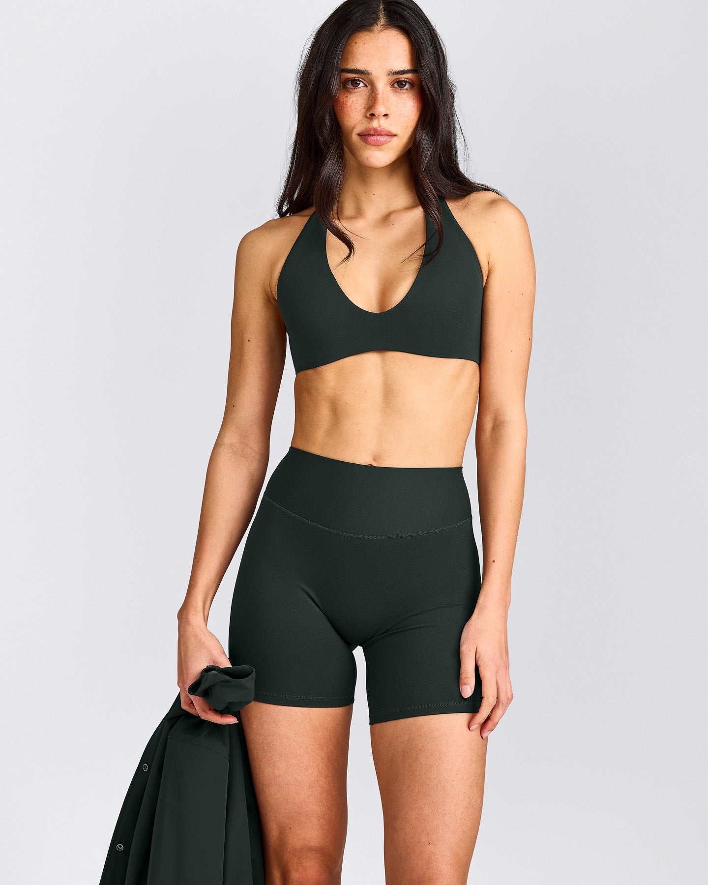 SoftMotion™ Minimal Halter Neck Bralette with Grey Logo | Emerald Noir