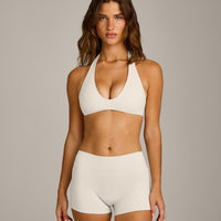 SoftMotion™ Minimal Halter Neck Bralette with Grey Logo | Marshmallow White