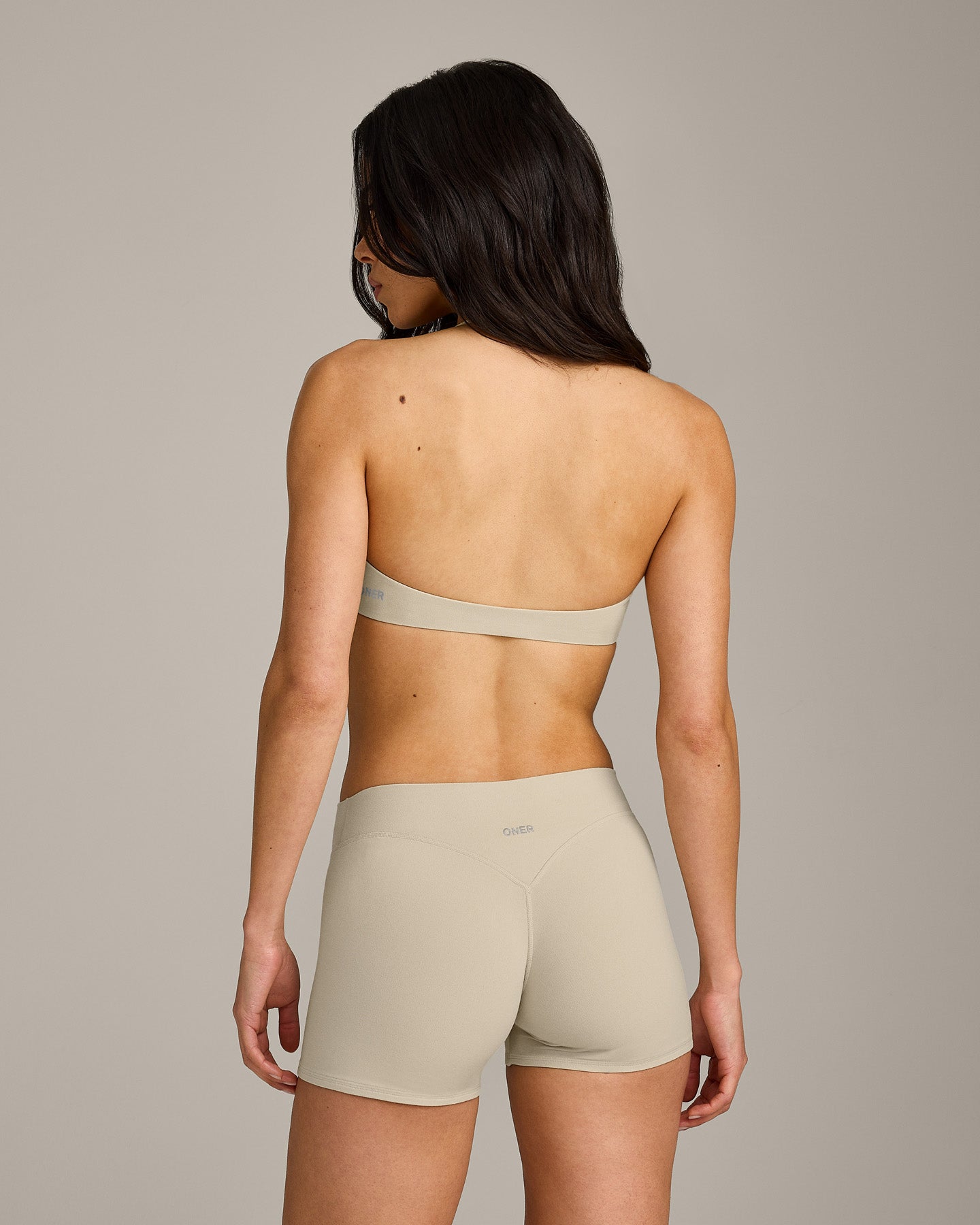SoftMotion™ Minimal Halter Neck Bralette with Grey Logo | Oatmeal