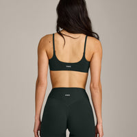 SoftMotion™ Strappy Sports Bra with Grey Logo | Emerald Noir