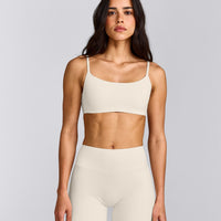 SoftMotion™ Strappy Sports Bra with Grey Logo | Marshmallow White
