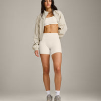 SoftMotion™ Strappy Sports Bra with Grey Logo | Marshmallow White