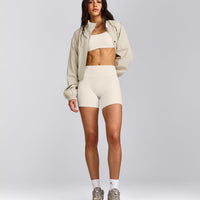 SoftMotion™ Strappy Sports Bra with Grey Logo | Marshmallow White