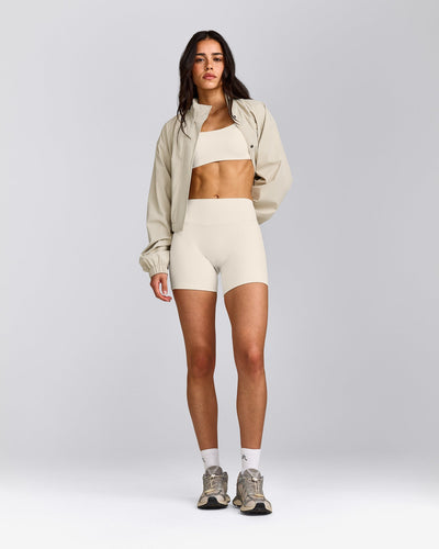 SoftMotion™ Strappy Sports Bra with Grey Logo | Marshmallow White