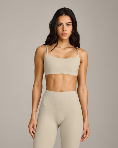 SoftMotion™ Strappy Sports Bra with Grey Logo | Oatmeal