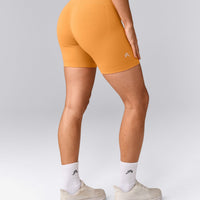 EffortlessLift™ Seamless Mid Rise Shorts with Grey Logo | Powdered Orange