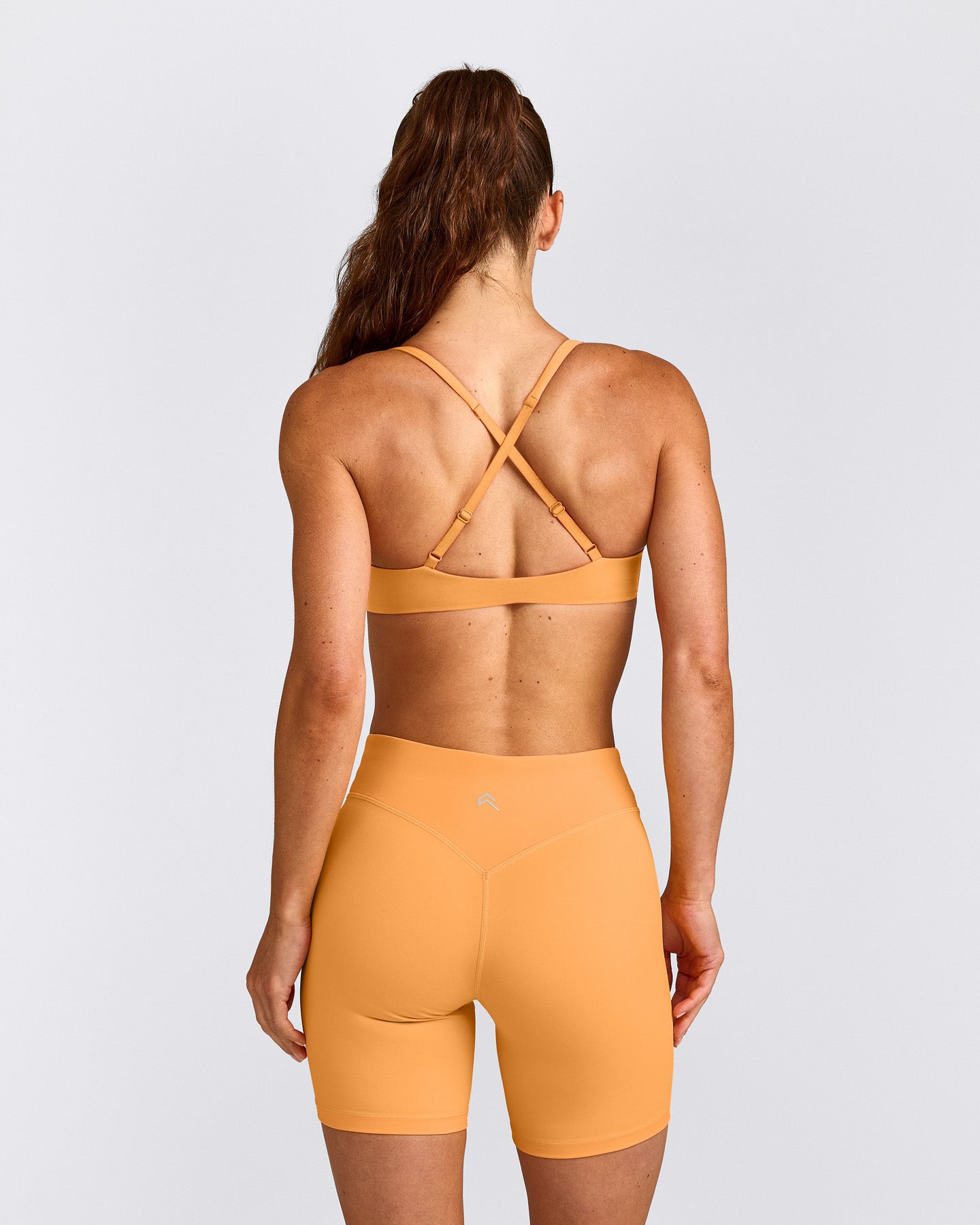 UnifiedMove™ Cross Back Sports Bra with Reflective Logo | Powdered Orange