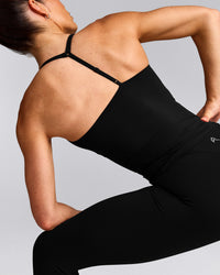UnifiedMove™ T Back Mid Vest with Built in Bra Shelf with Reflective Logo | Black