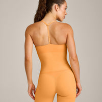 UnifiedMove™ T Back Mid Vest with Built in Bra Shelf with Reflective Logo | Powdered Orange