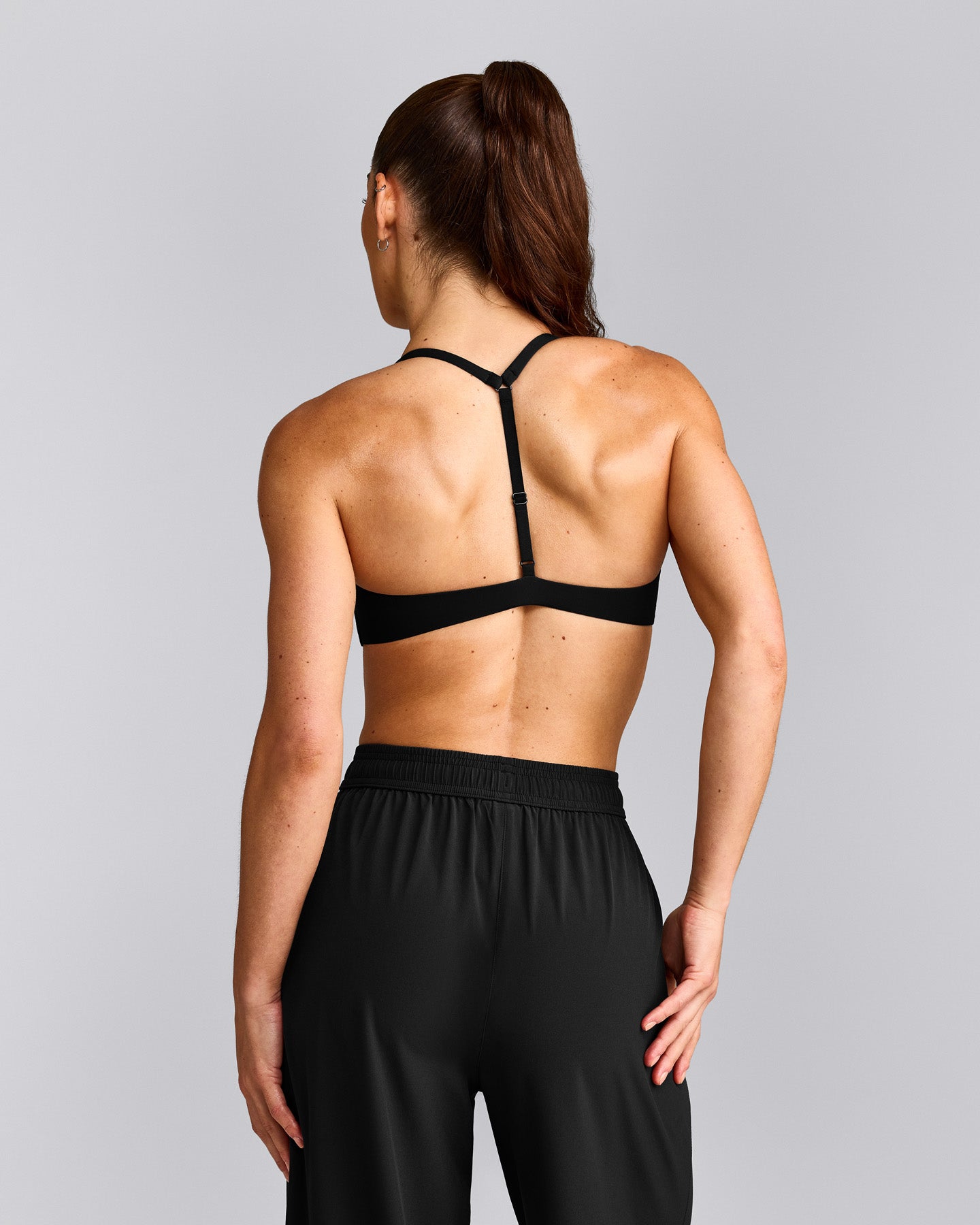 UnifiedMove™ T Back Minimal Bralette with Reflective Logo | Black