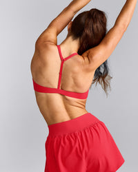 UnifiedMove™ T Back Minimal Bralette with Reflective Logo | Charged Pink