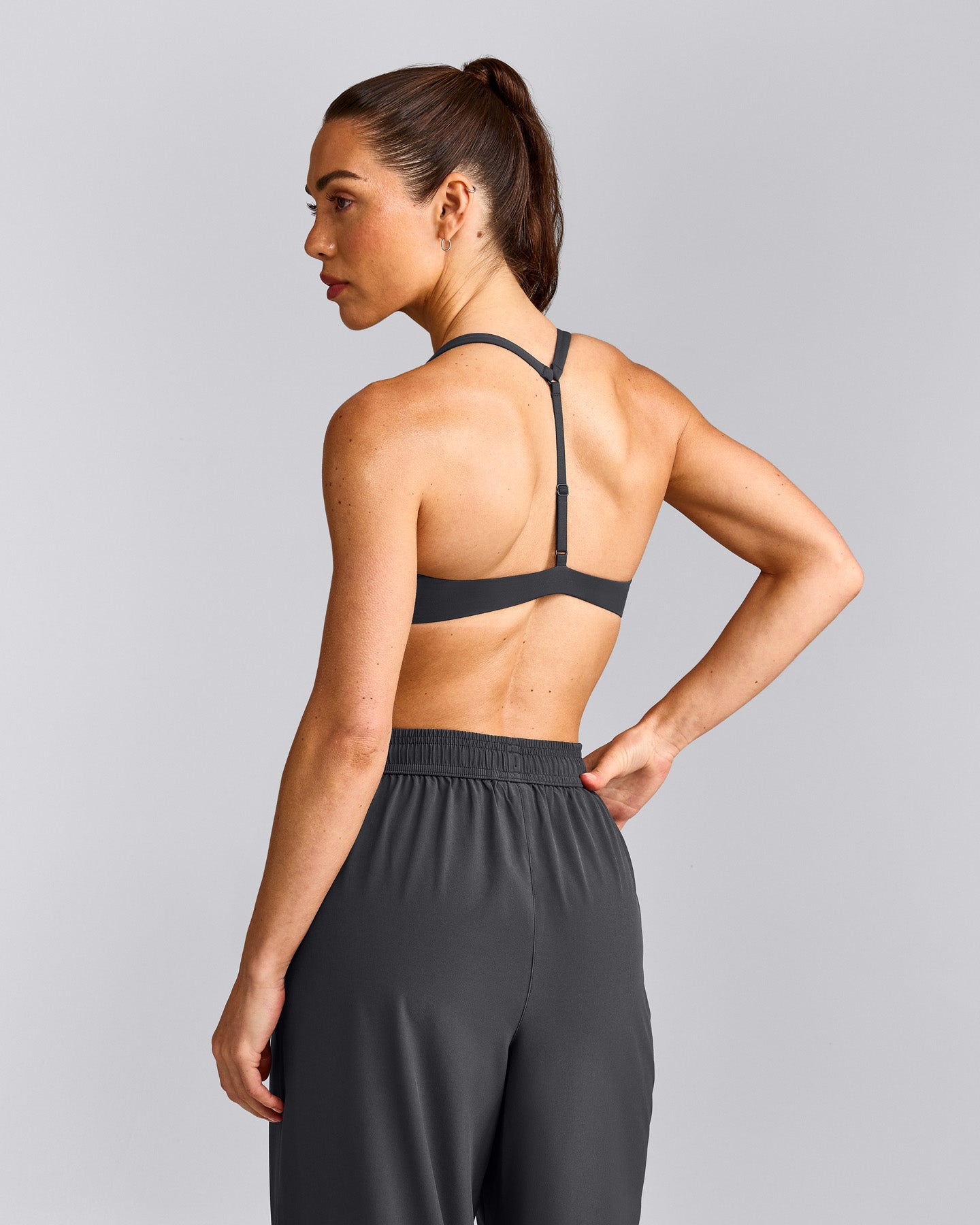UnifiedMove™ T Back Minimal Bralette with Reflective Logo | Coal