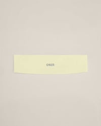 SoftMotion™ Headband with Grey Logo | Pastel Yellow