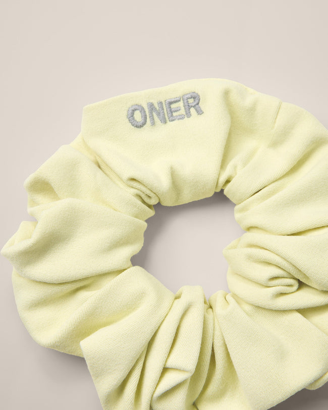 SoftMotion™ Scrunchie with Grey Logo | Pastel Yellow