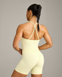 EnhanceLift™ Seamless Strappy Racer Vest with Built in Bra Shelf with Grey Logo | Pastel Yellow