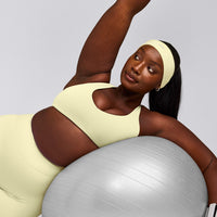 SoftMotion™ Bralette with Grey Logo | Pastel Yellow