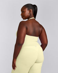 SoftMotion™ Halter Neck Mid Vest with Built in Bra Shelf with Grey Logo | Pastel Yellow