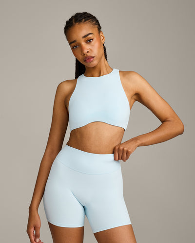 SoftMotion™ High Neck Sports Bra with Grey Logo |  Cloud Blue