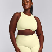 SoftMotion™ High Neck Sports Bra with Grey Logo | Pastel Yellow