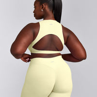SoftMotion™ High Neck Sports Bra with Grey Logo | Pastel Yellow