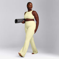 SoftMotion™ High Neck Sports Bra with Grey Logo | Pastel Yellow
