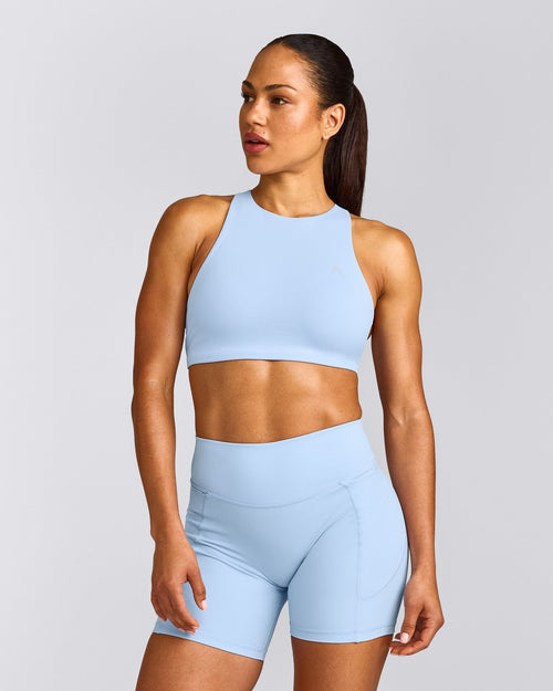 EasyLift™ High Neck Sports Bra with Grey Logo | Powdered Blue