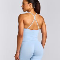EnhanceLift™ Seamless Strappy Racer Vest with Built in Bra Shelf with Grey Logo | Powdered Blue