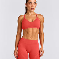EnhanceLift™ Seamless Strappy Sports Bra with Grey Logo | Dark Charged Coral