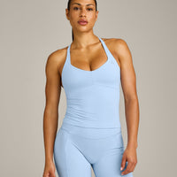 UnifiedMove™ T Back Mid Vest with Built in Bra Shelf with Reflective Logo | Powdered Blue