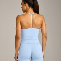 UnifiedMove™ T Back Mid Vest with Built in Bra Shelf with Reflective Logo | Powdered Blue