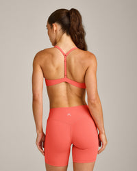UnifiedMove™ T Back Minimal Bralette with Reflective Logo | Light Charged Coral