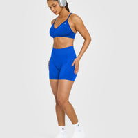 EnhanceLift™ Seamless Strappy Sports Bra with White Logo | Cobalt Blue