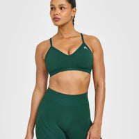 EnhanceLift™ Seamless Strappy Sports Bra with White Logo | Racing Green