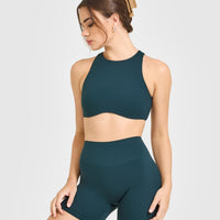 SoftMotion™ High Neck Sports Bra with White Logo | Oil Blue