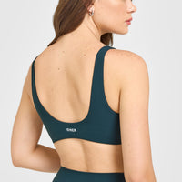 SoftMotion™ Scoop Back Bralette with White Logo | Oil Blue